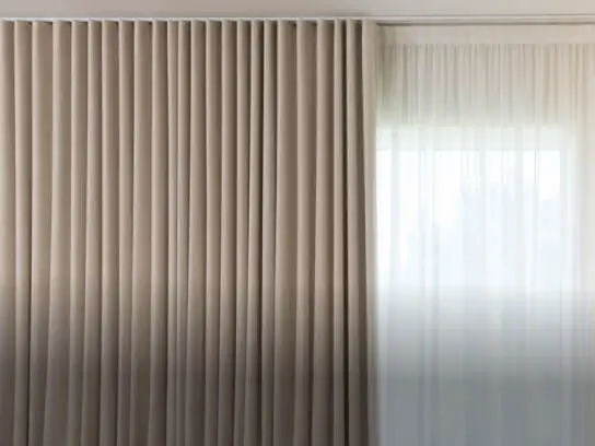 Motorized curtains with ripple fold design.